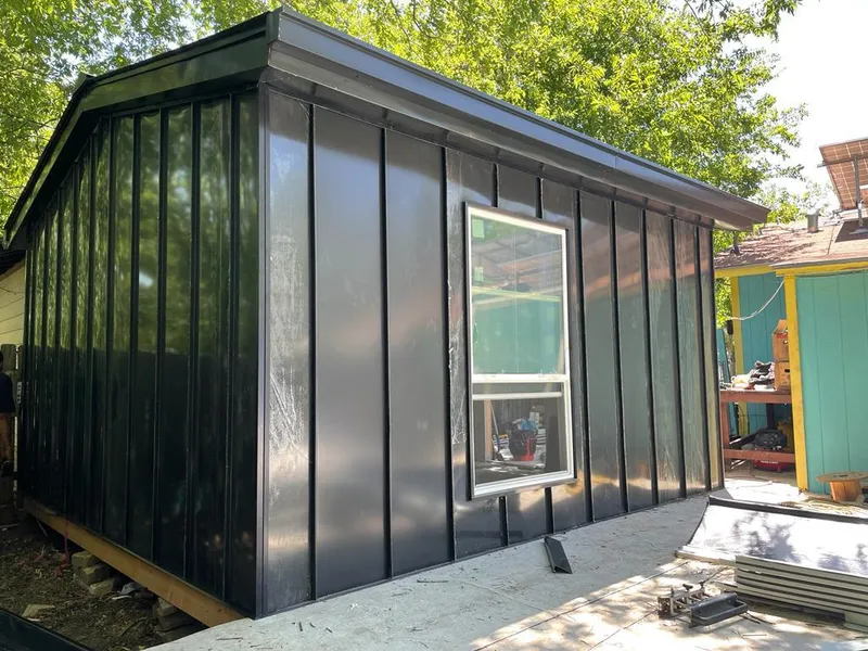 Black standing seam metal wall panels for Roof Inspection in Lake Jackson