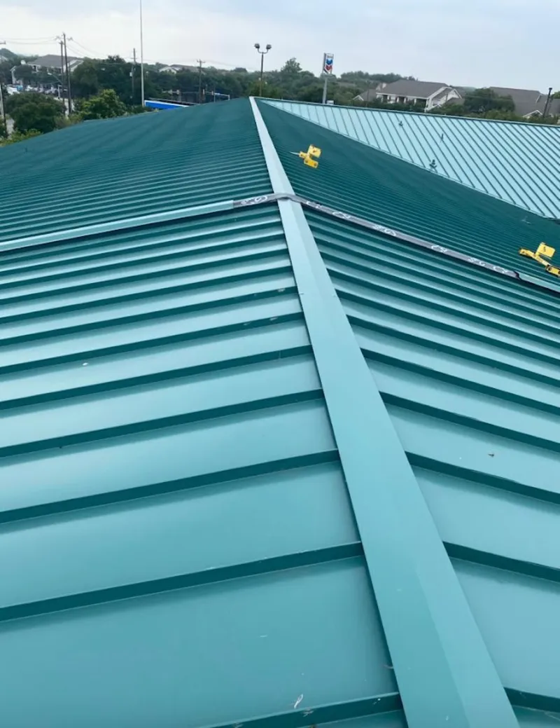 Green commercial metal roof ridge and valley for Metal Roof Repair in Lake Jackson